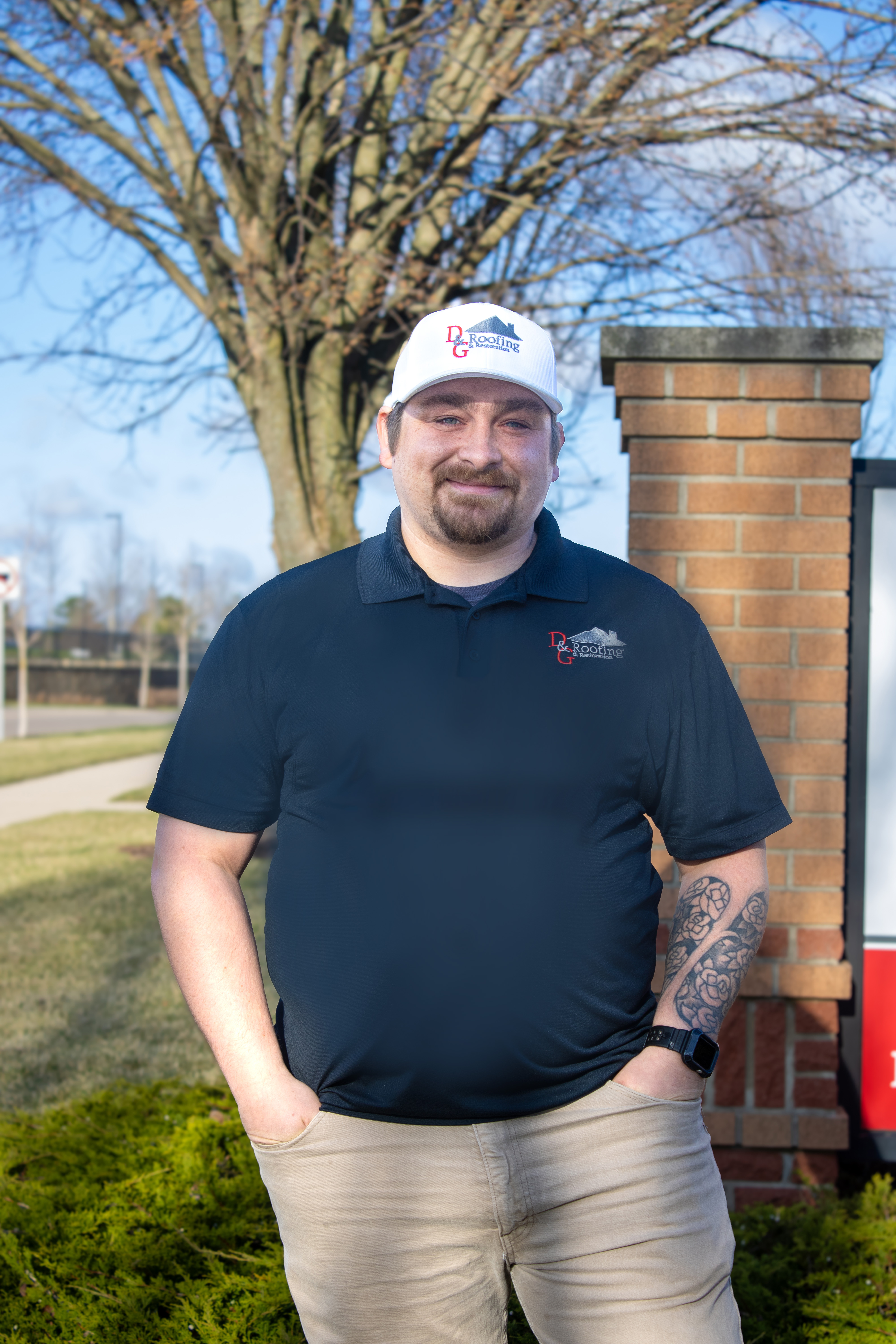 Image of our project consultant, Steven Laws standing near our outdoor sign